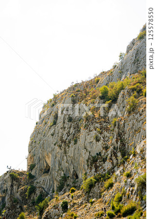 Mountainous landscape with a dam on the edge of the lake. Bovilla Lake - Albania. Mountainous landscape with a dam on the edge of the lake. Bovilla Lake - Albania. 125578550