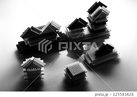 The black and white children's construction set focuses on form rather than color. The parts of the play-constructor create an abstract composition on a light background. The black and white children's construction set focuses on form rather than color. The parts of the play-constructor create an abstract composition on a light background. 125581628