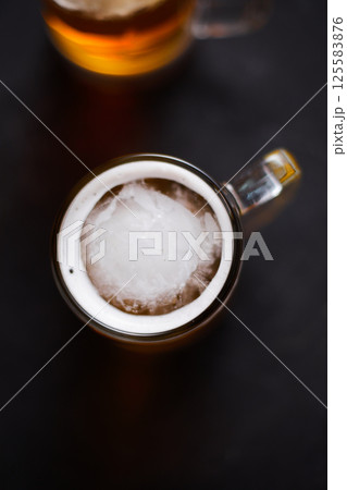 mug of beer on wooden table mug of beer on wooden table 125583876