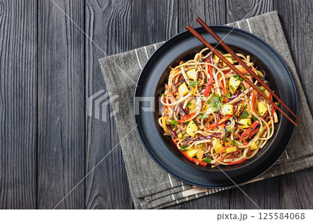 Thai Mango Noodle Veggie Salad in a bowl 125584068