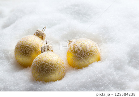Christmas balls in snow Christmas balls in snow 125584239