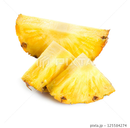 Pineapple slices on white background Pineapple slices on white background 125584274