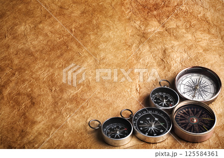 Compass on old paper 125584361