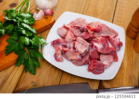 Raw chicken gizzards with spices and herbs Raw chicken gizzards with spices and herbs 125584613