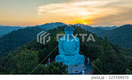 Aerial view of Majestic Buddha on the mountain at colorful sunrise 125589070