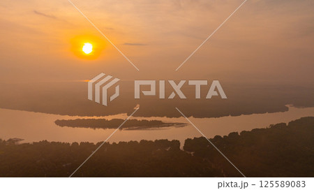 Aerial view of scenery sunrise over a river. 125589083