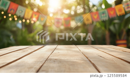 Wooden deck with colorful papel picado street decorations, Mexico holiday background 125589584