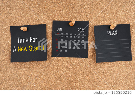 June 2026 calendar with Time for a new start and Plan text on black adhesive notes with wooden. June 2026 calendar with Time for a new start and Plan text on black adhesive notes with wooden. 125590216
