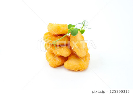 Crispy Chicken Nuggets with Fresh Microgreens 125590313