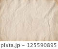 Vintage coffee-stained paper texture with soft wrinkles and aged edges. Perfect for scrapbooking, journaling, invitations, calligraphy, antique projects 125590895