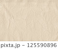Vintage coffee-stained paper texture with soft wrinkles and aged edges. Perfect for scrapbooking, journaling, invitations, calligraphy, antique projects 125590896