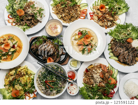 assortment of mixed traditional vietnamese food dishes on buffet table 125591122