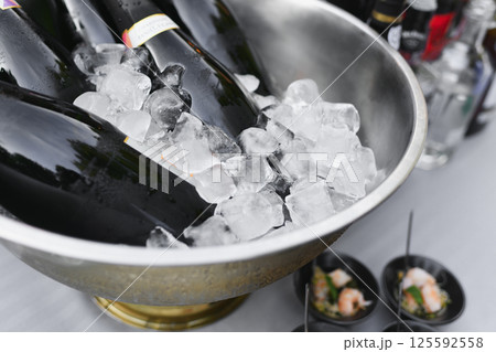Champagne Bottles on Ice at a French Wedding 125592558
