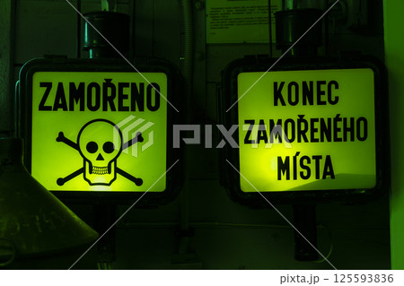 Contaminated area warning sign with skull and crossbones and end of contaminated area sign 125593836