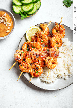 Grilled shimp prawn satay skewers with rice Grilled shimp prawn satay skewers with rice 125594052