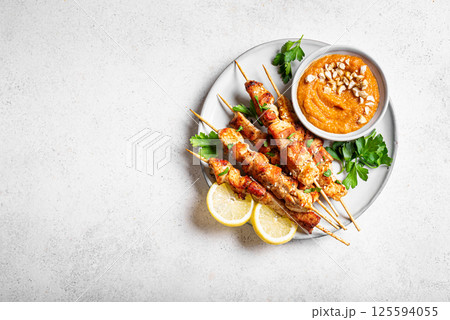 Grilled chicken satay with spicy peanut sauce Grilled chicken satay with spicy peanut sauce 125594055