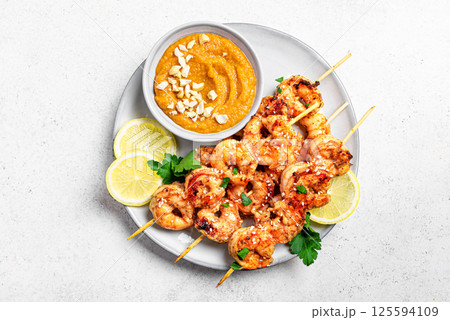 Grilled shrimp prawn satay skewers Grilled shrimp prawn satay skewers 125594109