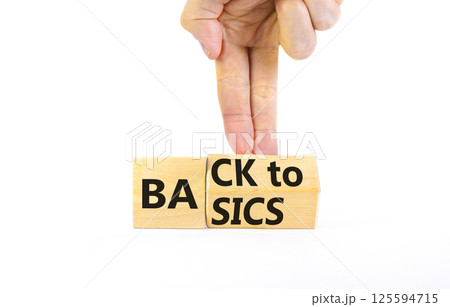 Back to basics symbol. Concept words Back to basics on wooden block. Beautiful white table white background. Businessman hand. Business back to basics concept. Copy space. Back to basics symbol. Concept words Back to basics on wooden block. Beautiful white table white background. Businessman hand. Business back to basics concept. Copy space. 125594715