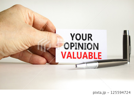 Your opinion valuable symbol. Concept words Your opinion valuable on beautiful white card. Beautiful white background. Businessman hand. Business your opinion valuable concept. Copy space. Your opinion valuable symbol. Concept words Your opinion valuable on beautiful white card. Beautiful white background. Businessman hand. Business your opinion valuable concept. Copy space. 125594724