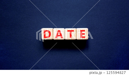Date symbol. Concept word Date on beautiful wooden blocks. Beautiful black table black background. Business and date concept. Copy space. Date symbol. Concept word Date on beautiful wooden blocks. Beautiful black table black background. Business and date concept. Copy space. 125594827