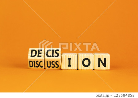 Discussion and decision symbol. Concept word Discussion and Decision on wooden cubes. Beautiful orange table orange background. Business discussion and decision concept. Copy space. Discussion and decision symbol. Concept word Discussion and Decision on wooden cubes. Beautiful orange table orange background. Business discussion and decision concept. Copy space. 125594858