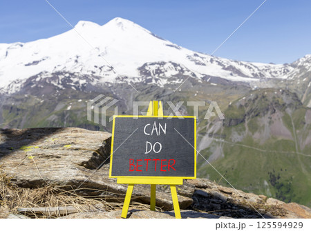 Can do better symbol. Concept words Can do better on beautiful blackboard. Beautiful mountain Elbrus background. Business and can do better concept. Copy space. 125594929