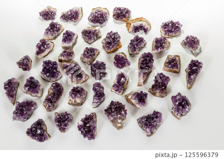 Amethyst Crystal Druse macro mineral on white background Amethyst Crystal Druse macro mineral on white background 125596379