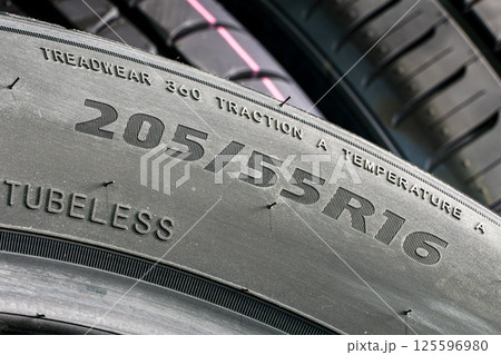 Side view of a tire with an indication of tire width, height, diameter and other quality indices 125596980