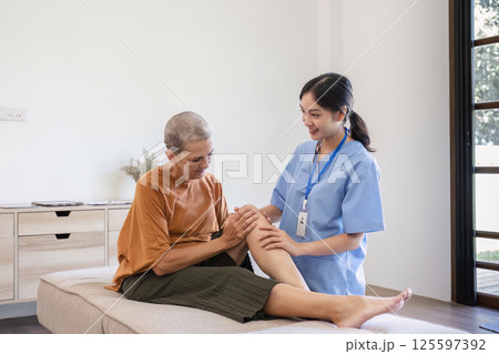 Young Nurse Providing Health Care Advice to Elderly Woman in a Comfortable Home Setting Young Nurse Providing Health Care Advice to Elderly Woman in a Comfortable Home Setting 125597392