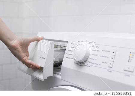 Hand Opening Detergent Drawer of Washing Machine Hand Opening Detergent Drawer of Washing Machine 125599351