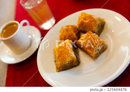 Turkish dessert baklava with honey and nuts 125604876