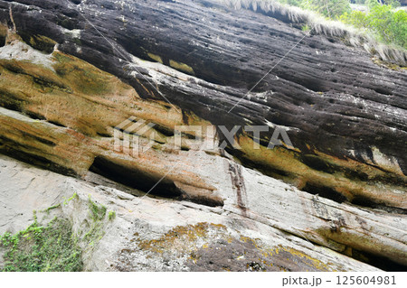 weathered rock surfaces in the mountains weathered rock surfaces in the mountains 125604981