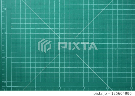 green cutting mat board background with line and scale measure guide pattern for object art design green cutting mat board background with line and scale measure guide pattern for object art design 125604996