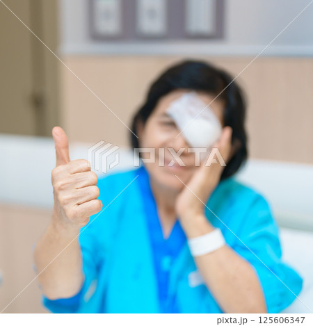 Elderly Woman with eye protective shield after eye surgery. Eye disease, Cataract,  Glaucoma, Age Related Macular Degeneration, Diabetic Retinopathy, Vitreous, Lasik, World Glaucoma day and health 125606347