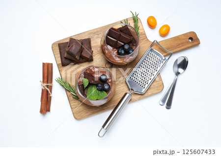 Preparation of chocolate mousse, on a light table. Preparation of chocolate mousse, on a light table. 125607433
