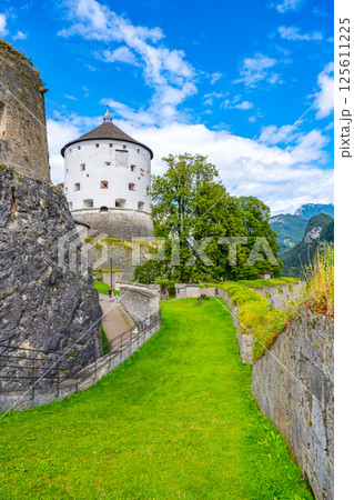 Historic Kufstein Fortress stands majestically in Tyrol, Austria, surrounded by lush greenery and dramatic skies, inviting visitors to discover its rich history and panoramic views of the Alps. Historic Kufstein Fortress stands majestically in Tyrol, Austria, surrounded by lush greenery and dramatic skies, inviting visitors to discover its rich history and panoramic views of the Alps. 125611225