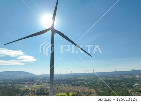 Wind energy and sustainable power generation with wind turbines, Eco-friendly solutions for renewable resources. Wind power farm and sustainable development of renewable energy, green technology. 125613128
