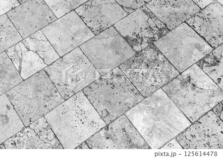 Rustic black and white image of square stone tiles, background texture Rustic black and white image of square stone tiles, background texture 125614478