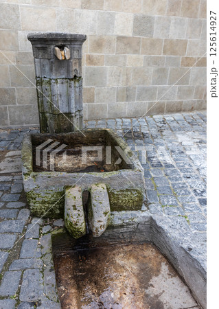 An ancient stone fountain with drinking water, Baku, Azerbaijan 125614927
