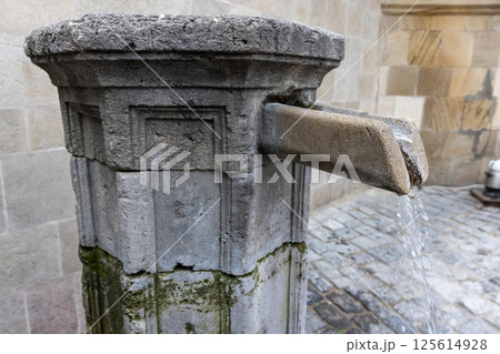 Rustic scene of an old stone fountain flowing with water, Baku Rustic scene of an old stone fountain flowing with water, Baku 125614928