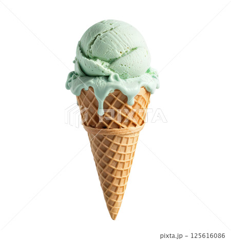 Creamy green mint ice cream in waffle cone, melting slightly, evokes refreshing and delightful treat perfect for warm days. Enjoy sweet, cool flavor that brings joy to every bite. 125616086