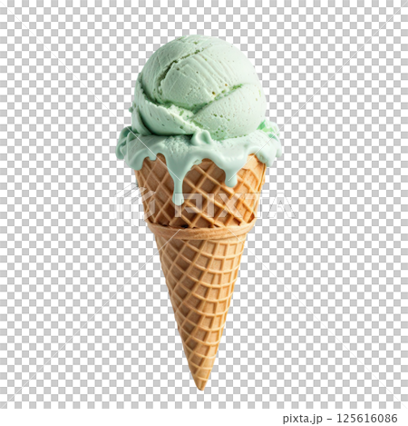 Creamy green mint ice cream in waffle cone, melting slightly, evokes refreshing and delightful treat perfect for warm days. Enjoy sweet, cool flavor that brings joy to every bite. 125616086