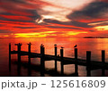 Red sunset on the lake with a wooden pier 125616809
