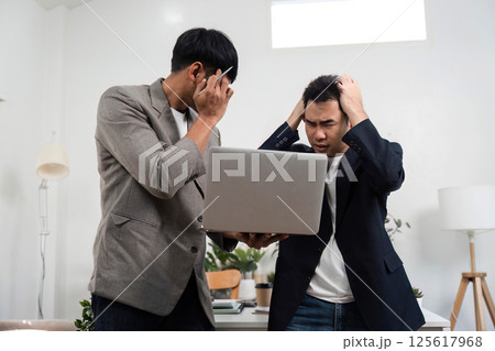 Emotional Communication and Conflict Management. Two professionals navigating a tense conversation in a modern office. Emotional Communication and Conflict Management. Two professionals navigating a tense conversation in a modern office. 125617968