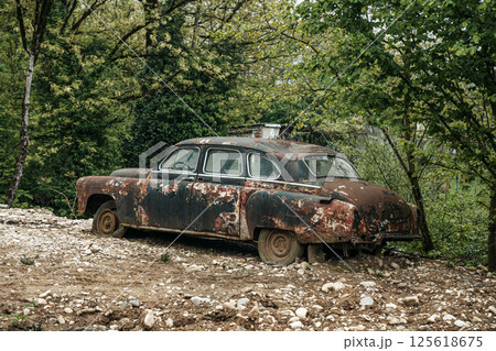 Old rusty car. Abandoned retro vintage car from the 60s Old rusty car. Abandoned retro vintage car from the 60s 125618675