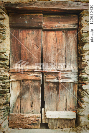 Ancient wooden door 125620430