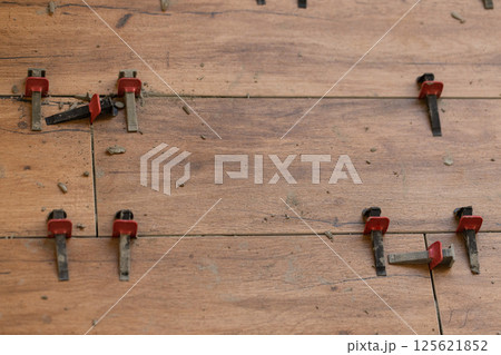 Tile Leveling System Components on The Floor. Closeup, selective focus. 125621852