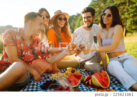 Happy groop of friend resting in nature in picnic. People, lifestyle, relaxation, vacations concept. Happy groop of friend resting in nature in picnic. People, lifestyle, relaxation, vacations concept. 125621861