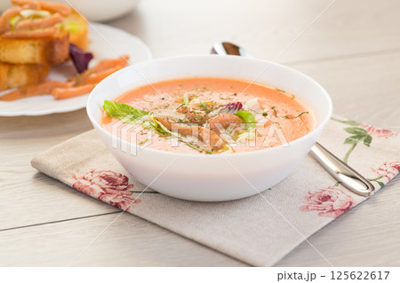 Thick and creamy cream soup of trout in a plate 125622617