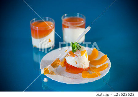 Portioned jelly dessert with yogurt cream and fruits Portioned jelly dessert with yogurt cream and fruits 125622622
